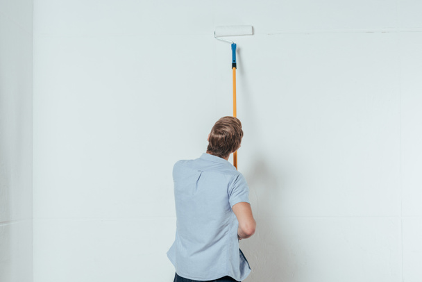 stock-photo-back-view-young-man-using.png